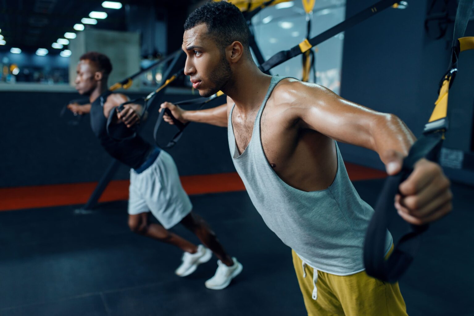 Two muscular athletes in sportswear